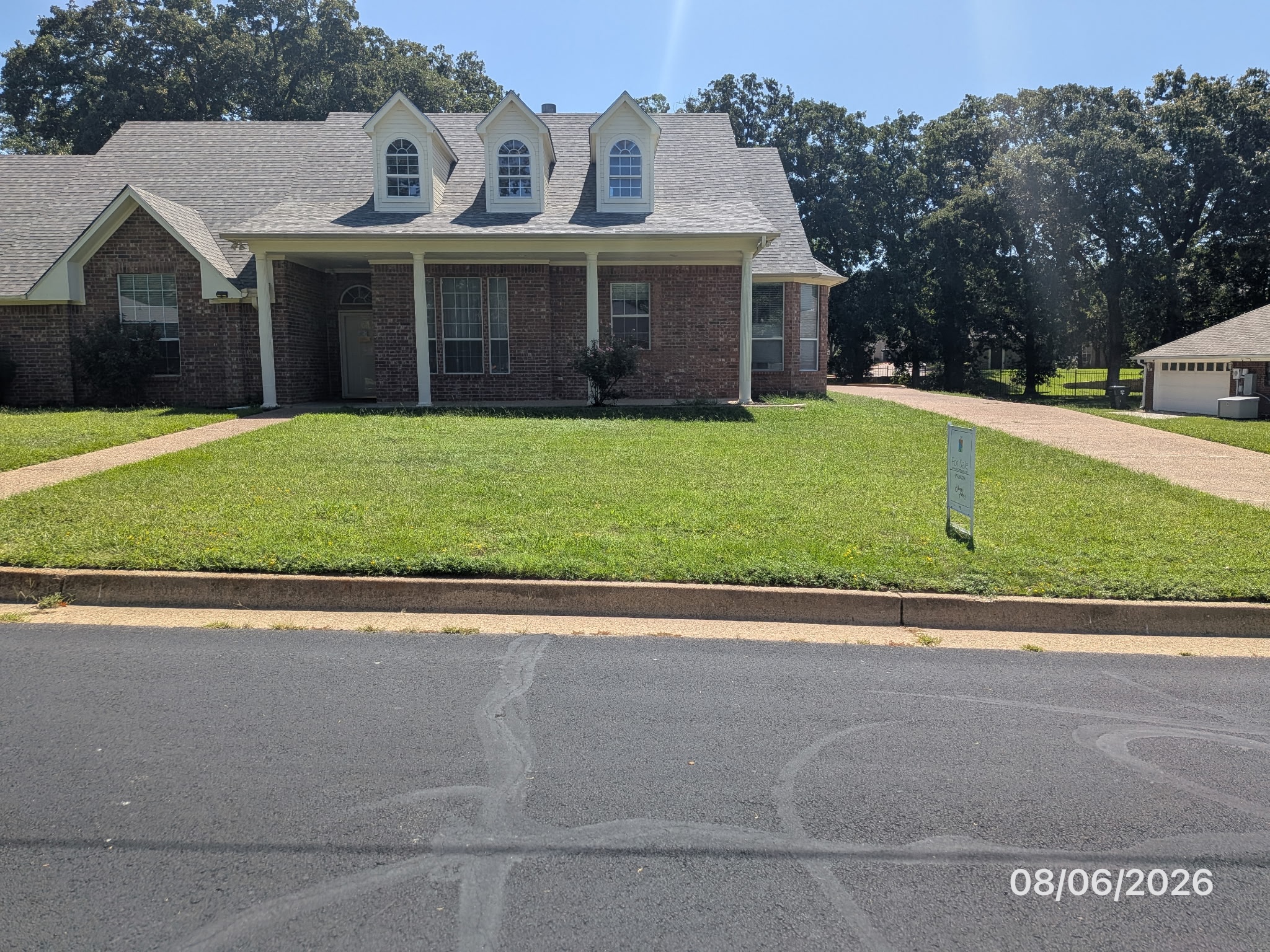 Brick exterior, covered front porch and lawn at 3814 Lamb Drive
